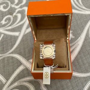 Tory Burch orange/clear watch. Swiss made. New in box